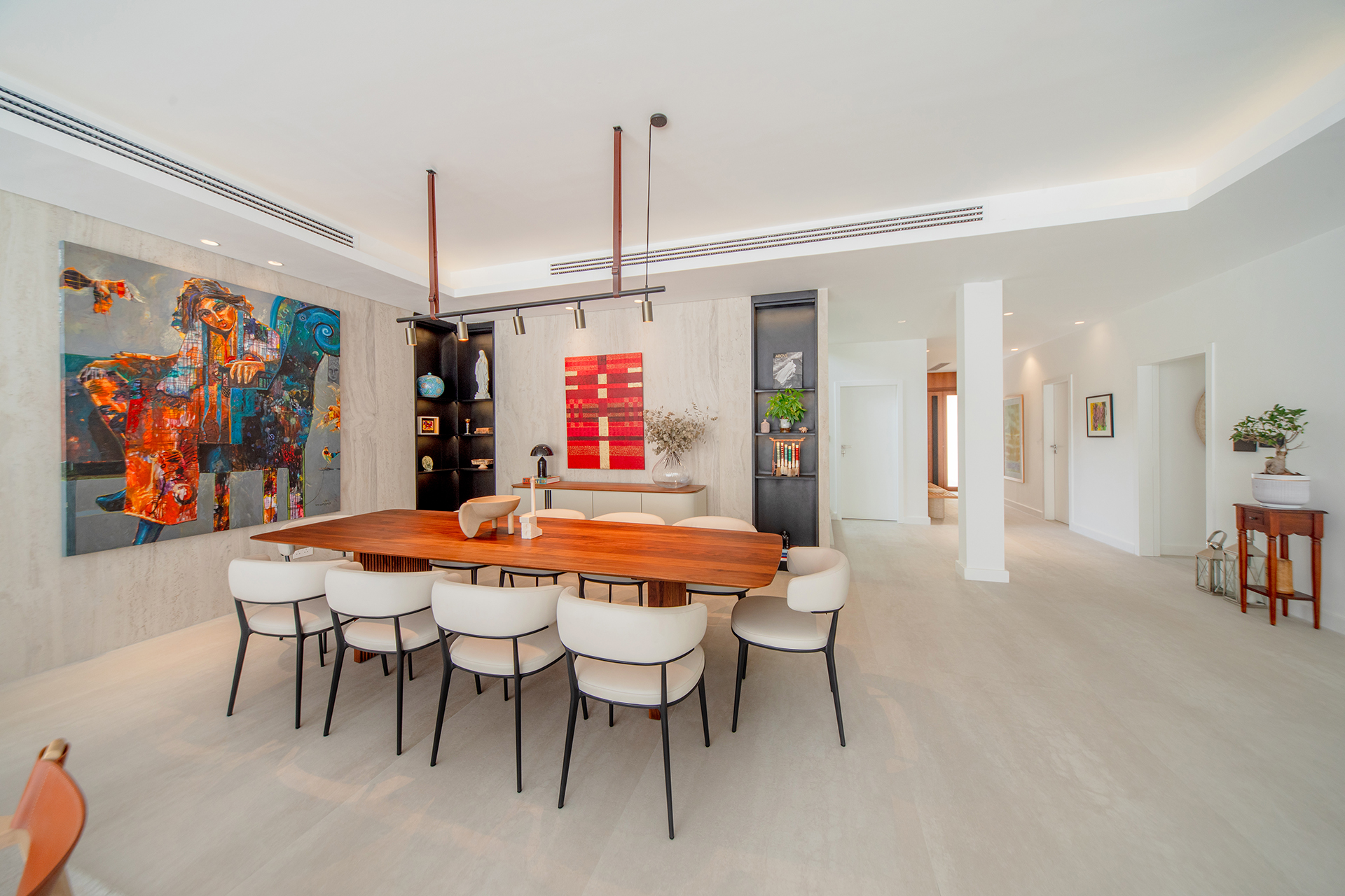 Dining room of Modern Bogota villa by Smart Renovation, showcasing how vibrant accent pieces can seamlessly enhance minimalist interior design