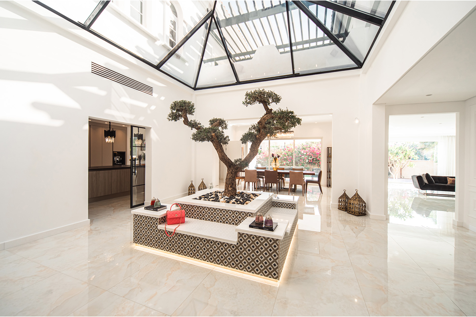 The receiving area of Villa Chanel redefines minimalist interior design as a curated space with neutral accents and striking patterns.