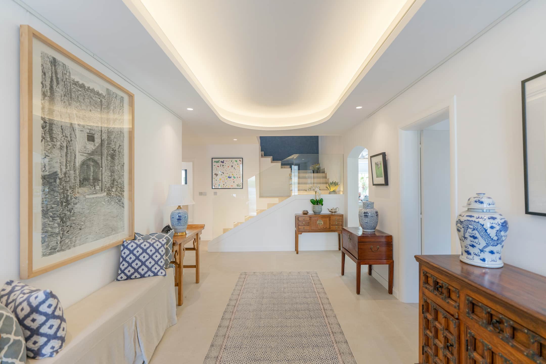 Louis Vuitton Voyage Villa demonstrates effective space planning in a wide hallway with integrated seating and storage.